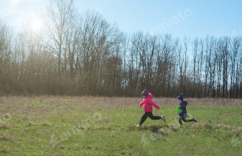 Preview: Children outdoors on a sunny day running with a frisbee