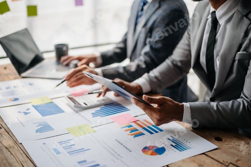 Preview: Financial Professionals Discussing Business Data in the Office