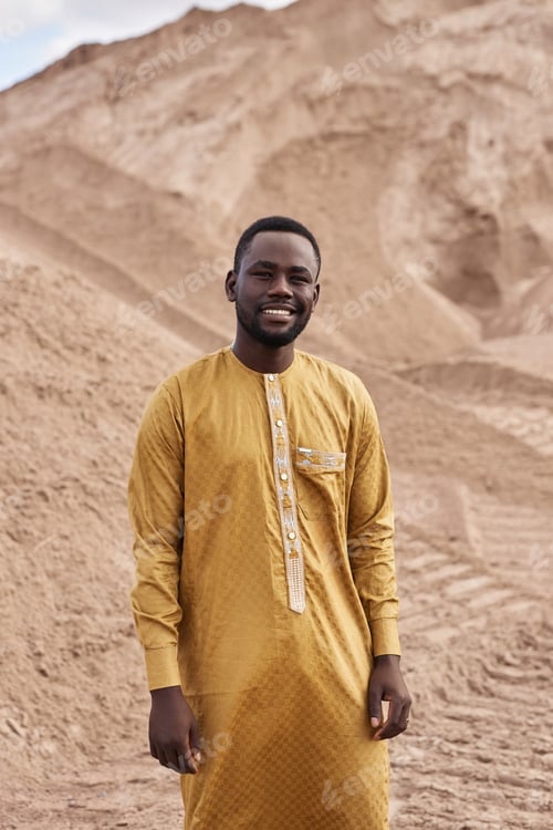 Preview: African American Man in Traditional Kaftan in Desert