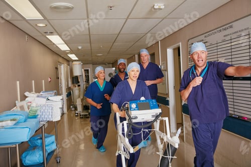 Preview: Showing some urgency. Shot of a medical team rushing through a hospital corridor.