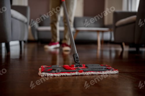 Preview: Woman Mops Floor In Room, Close Up