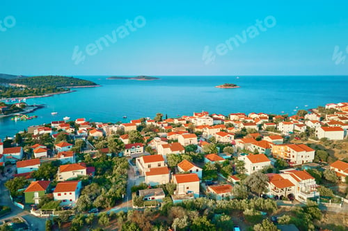 Preview: Aerial view of residential buildings of coastal town near sea beach