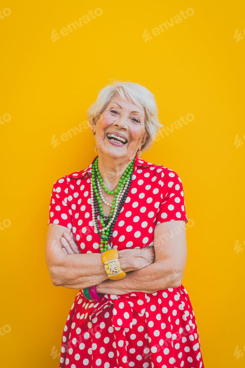 Preview: Funny grandmother dancing on colored background