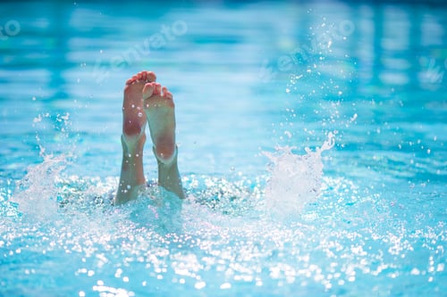 Preview: Happy little girl having fun in outdoor swimming pool