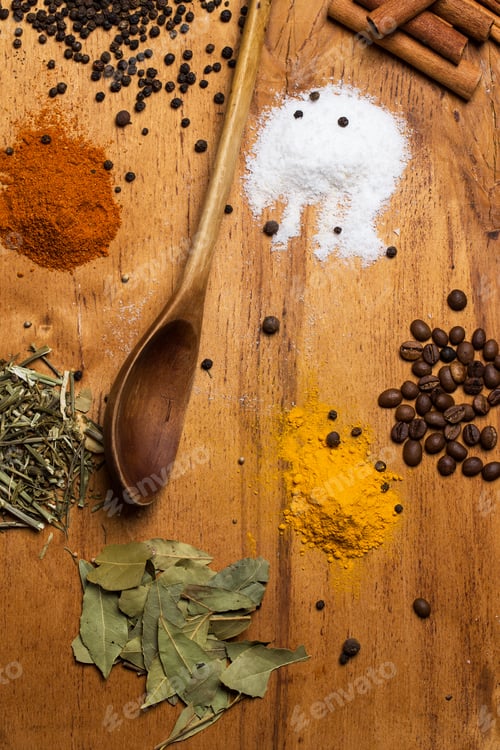 Preview: Spoon and heap of spices on the table