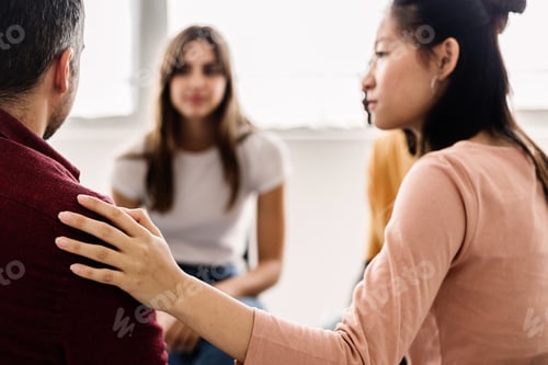 Preview: Diverse young teenage people receiving support during a therapy session.