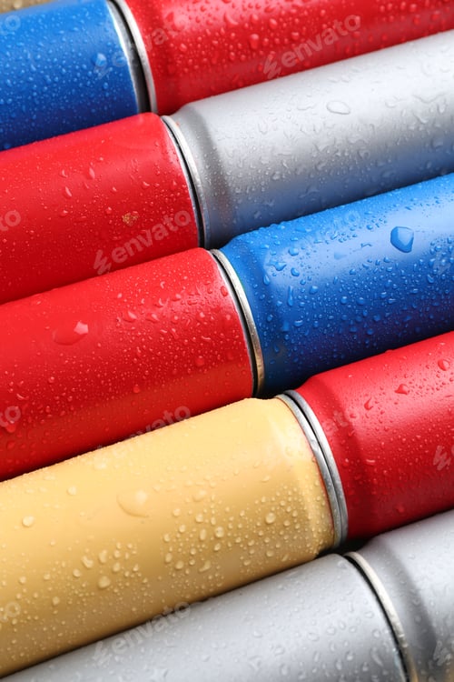Preview: Energy drinks in wet cans as background, closeup