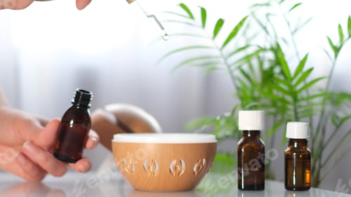 Preview: Modern aroma oil diffuser on the white table. Spa concept for body