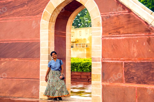 Preview: Woman tourist at the Jantar Mantar observatory, Jaipur, UNESCO World Heritage Site, India.