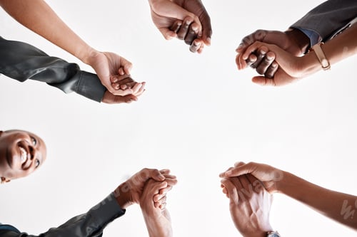 Preview: Diversity, support and collaboration of business people holding hands below in trust for company su