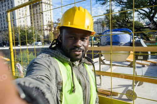 Preview: selfie portrait of african man employee smiling at the construction site during his working day