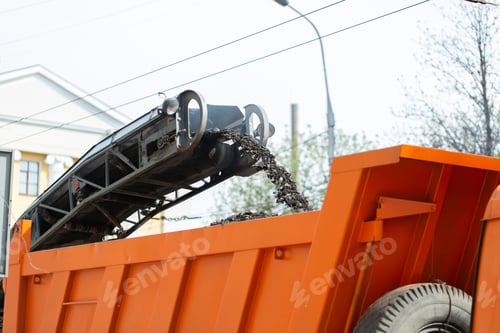 Preview: Road milling machine removes old asphalt and loads milled asphalt into the dump truck.