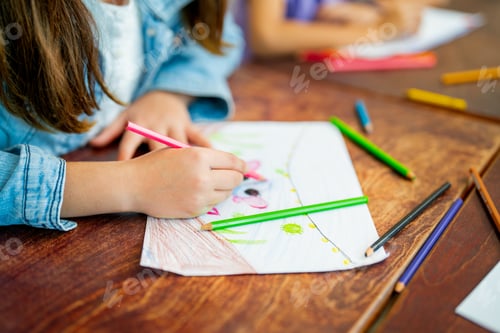 Preview: Close up hands of little girl draw and paint the picture on paper and sit near her friend