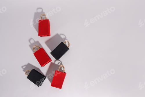 Preview: Black friday sale event design creative concept, red and black shopping bags with shadows