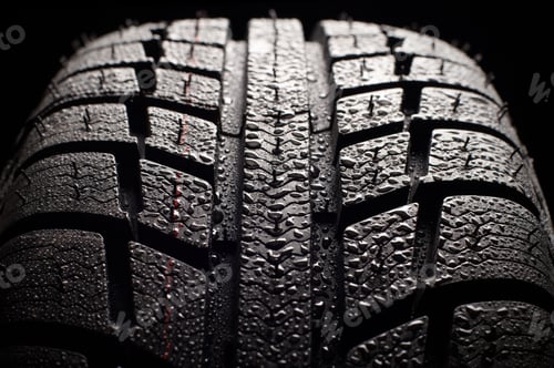 Preview: Wet Car Tire Tread in Close-Up Shot