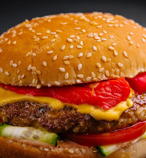 Preview: Delightful gourmet cheeseburger on dark background