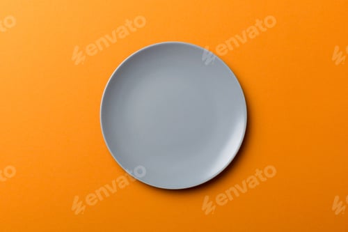 Preview: Top view of isolated of colored background empty round gray plate for food.