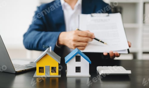 Preview: Buying a home or insurance deal, an insurance agent pointing a pen to those interested in renting