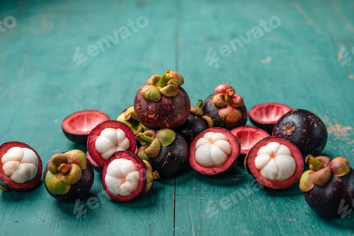 Preview: Mangosteen fruit on light blue wooden background,Tropical fruit