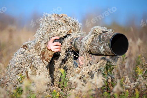 Preview: Wildlife photographer in the ghillie suit working