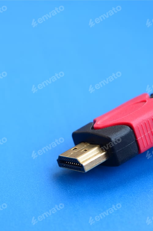 Preview: Black audio video HDMI computer cable on blue background