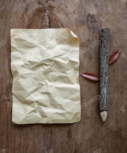 Preview: Blank crumpled paper and wooden pencil on wooden background