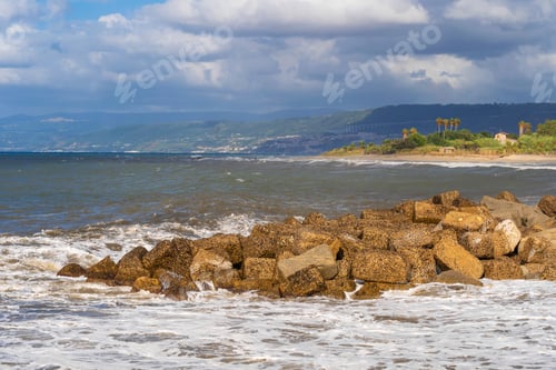 Preview: Ocean wave crashing onto rocky shoreline