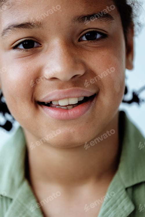 Preview: Child brushing teeth with a big smile, promoting dental hygiene and healthy habits in a joyful