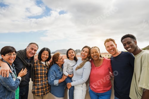 Preview: Group of multigenerational friends smiling in front of camera