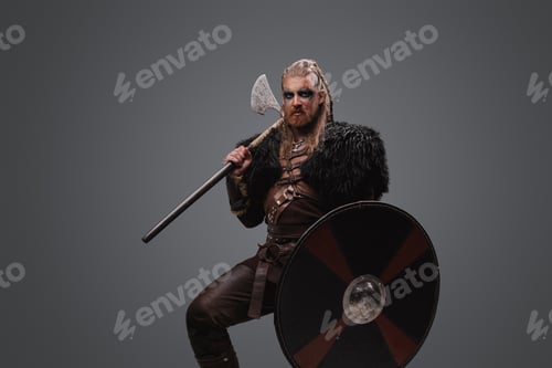 Preview: Barbaric viking with axe and shield against grey background