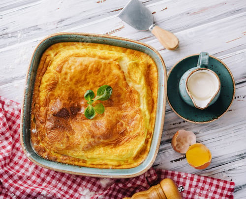 Preview: Delicious pie with meat and basil on wooden table, flat lay