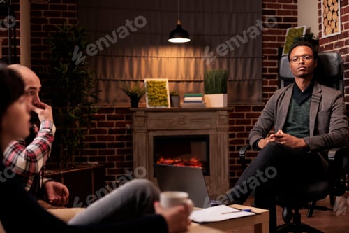 Preview: Portrait of marriage counselor listening to unhappy couple at therapy