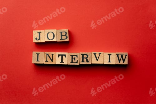 Preview: a yellow warm background without shadows wooden cubes with black letters laid out word job interview