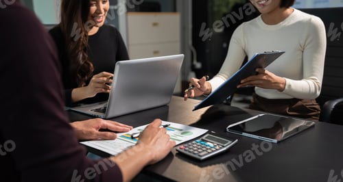 Preview: Businessmen team or financial data analysts working with tablets and laptop computers.
