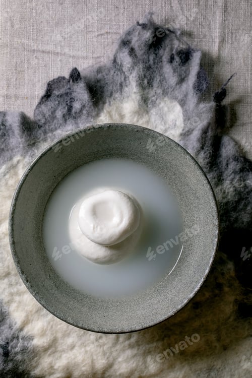 Preview: Traditional italian burrata knotted cheese in bowl