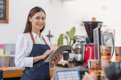 Preview: Startup successful small business owner sme beauty girl and apron hodding tablet at the bar