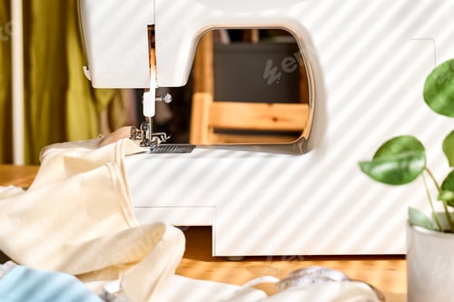 Preview: Sewing machine with linen cloth. Industry, fashion concept. Slow fashion. Conscious consumption.