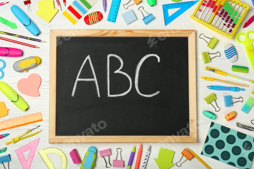 Preview: Flat lay composition with different school stationery and small chalkboard on wooden background