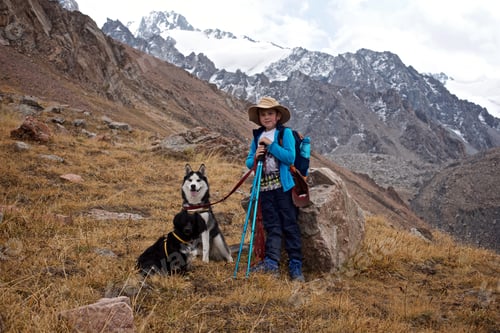 Preview: Happy Child Hiking with Dogs in Mountains