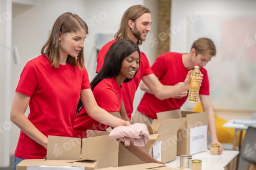 Preview: Young people working in a donations distribution center