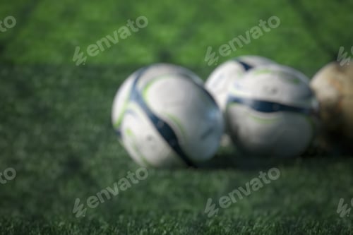 Preview: Blurry soccer ball on green field background