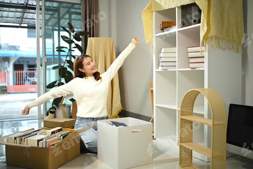Preview: Young asian woman excited for moving into a new house. Relocating concept