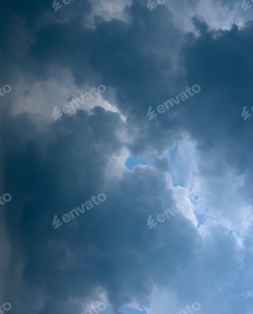Preview: Evening sky with blue, white clouds.