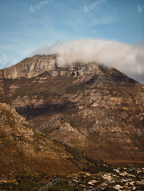 Preview: Majestic mountain peak surrounded by white clouds in South Africa