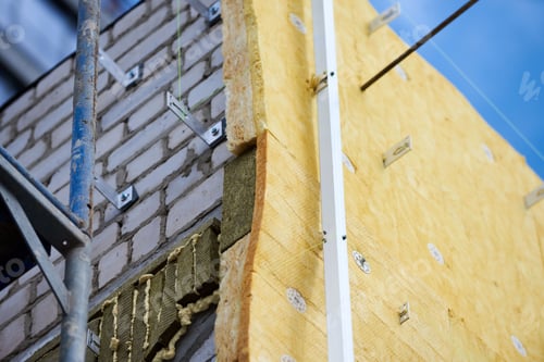 Preview: office building under construction. Facing and insulation of walls