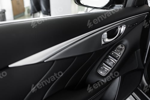 Preview: details of the car interior, black leather interior. windows control panel