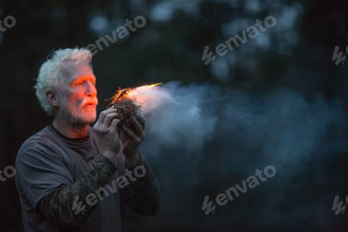 Preview: Man starting fire light