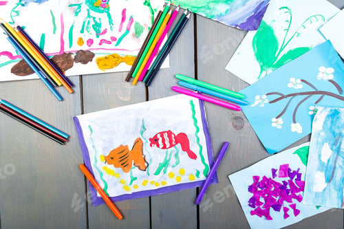 Preview: Child pictures. Top view. Kid drawings. Flat lay.