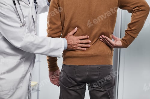 Preview: Doctor Examineing Lumbar Spine Of His Patient To Find Possible Reasons Of Pain
