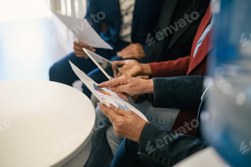 Preview: Crop coworkers with papers in office